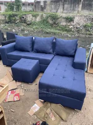 A 6 Seater Sofa With Center Puff