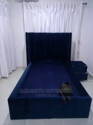 4.5 by 6ft Blue Padded Bed Frame