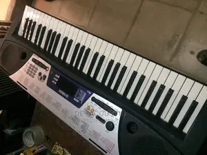 Yamaha EZ 150 Portable Keyboard With Adaptor