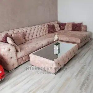 L-Shaped Fabric Sofa With a Center Ottoman Can Come in Color