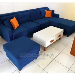 L-shaped Fabric Sofa +Ottoman And A Coffee Table