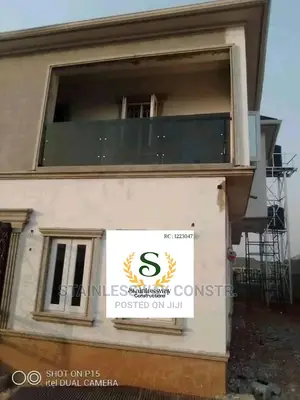 Stainless Dark Grey Glass Balcony Railing at Karmo Abuja