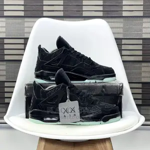 Original Air Jordan 4 Retro ‘Kaws’ Black Sneakers Available