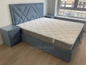 Padded 6 by 6 Bed With Foot Rest Up for Grab