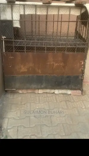 An Iron Rod Standard Cage For Rearing Of Dogs And Chicken.