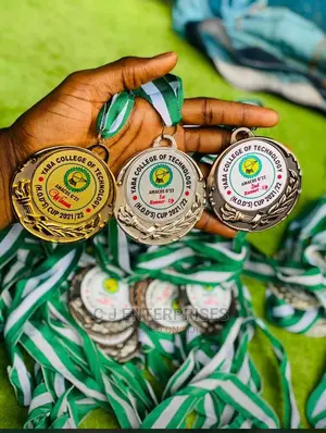 Silver, Gold and Bronze Medal With Green and White Rope