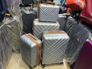 Set of Quality Silver Plastic Traveling Luggage With Kit