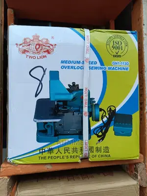 Two Lion Overlooking Sewing Machine
