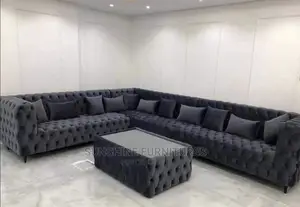 Buttoned L Shaped Sofa With Glass Top Center Table