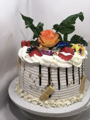 White and Gold With Chocolate Toppings Birthday Cakes