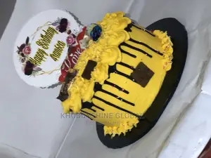 Golden Yellow With Chocolate Toppings Birthday Cakes