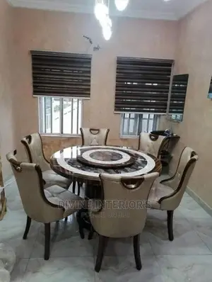 Round Marble Dinning With Six Leather Chairs