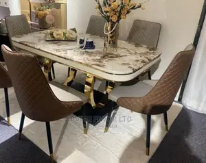 Imported Dining Set With Marble Top Table and Leather Seats.