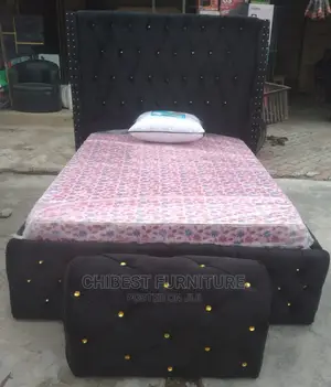 Quality 4.5by6 Upholstery Padded Bed Frame With One Ottoman.