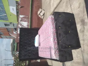 Quality 4.5by6 Upholstery Padded Bed Frame With One Ottoman.
