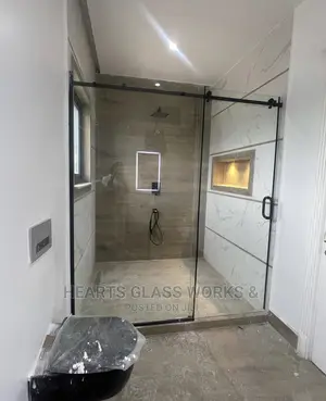 Shower Enclosure With Black Boardings And Accessories