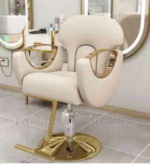 Barbing Salon/Hairdressing Chair With Gold Footrest.
