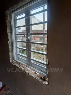 White Casement Window With Burglary and Net