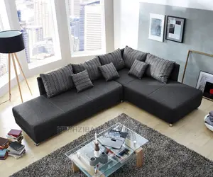 Black L Shaped Sofa With Grey Pillows