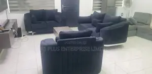 A Curvy 3,2,1 Sofa Set With A Fabric Finish + Center Table.