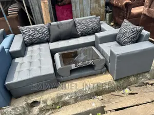 A Standard Grey Sofa With Center Table