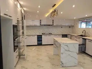 U-shaped Kitchen In A Sleek Black And White Design