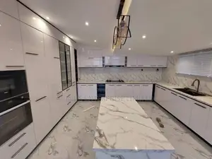 U-shaped Kitchen In A Sleek Black And White Design