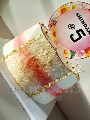 Pink and White Birthday Cake for a Baby Girl