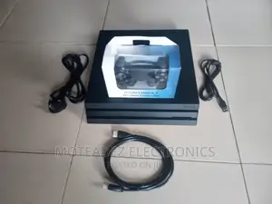 Uk Used Sony Ps4 Pro With Games Installed, 2 Pads and Cables