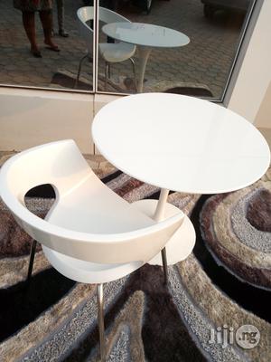 A White Discusion Table With Chair