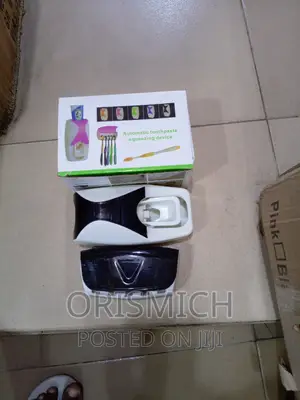 Tooth Paste Dispenser and Toothbrush Holder