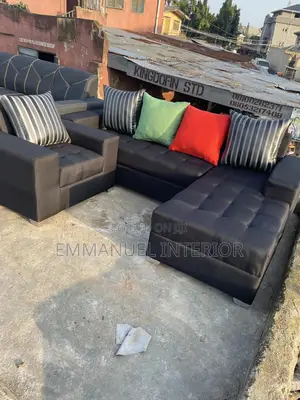 A Standard L Shape Sofa With Additional Single