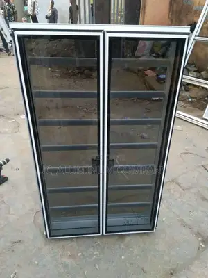 White Frameless Window With Burglary and Net