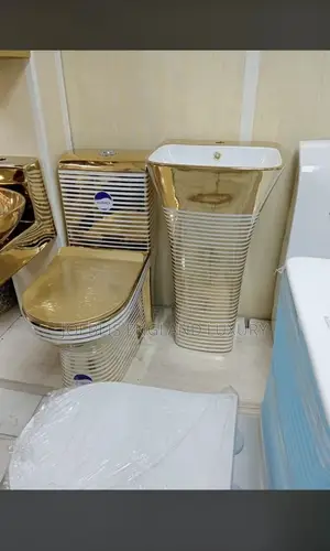 Gold and White Water Closet With Wrinkle Design