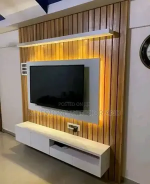 Wall-Clauded Tv Panel With Suspended Console and Led Lights
