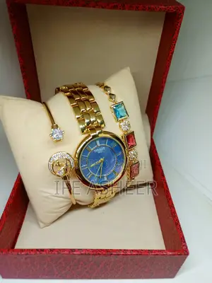 Ladies Tissot Blue Face Watch With 2 Bracelets - Gold