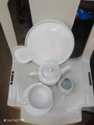 Sets of Tea Cups, Saucers and Kettle