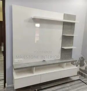 Simple Bachelor's Tv Design Complimented With Shelves