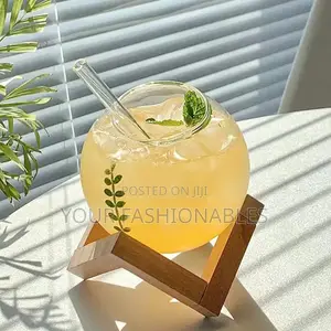 Spherical Borosilicate Glass Cup on a Wooden Stand