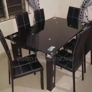 Glass Dinning Table With Six Units of Chairs