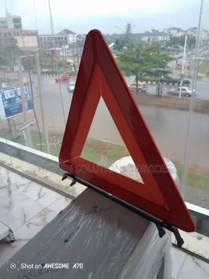 Road Safety With A Reflective Warning Triangle And Stand