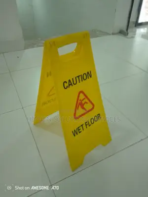 Wearing Caution Wet Floor Sign