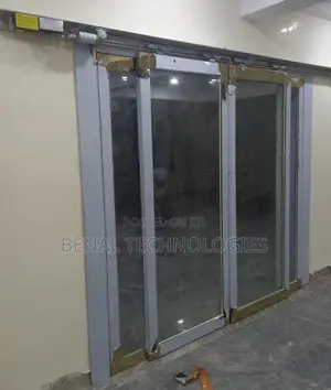 Sensor-Activated Door With Sliding Glass