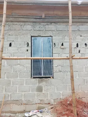 White Frameless Window With Grey Reflective Glass