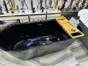 Black Bathtub With Gold Faucet
