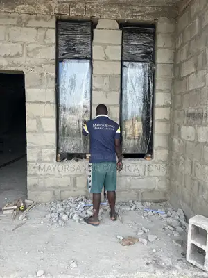 Frameless Window With Black Profile And Gray Glass