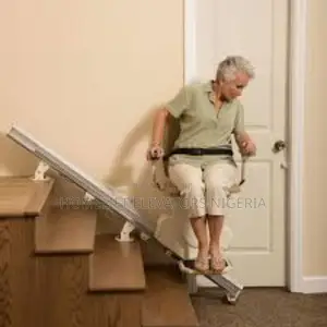Senior Woman Using Automatic Stairlift