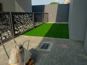 Artificial Grass Next to Real Grass Green