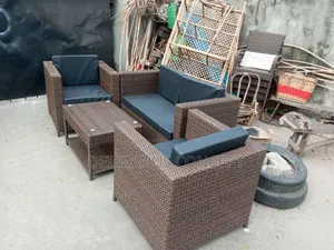 Brown Cane Chair With Black Cushion for Outdoor