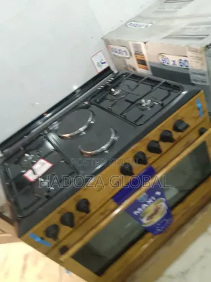Maxi 60by90 Gas Cooker With Lamp on It